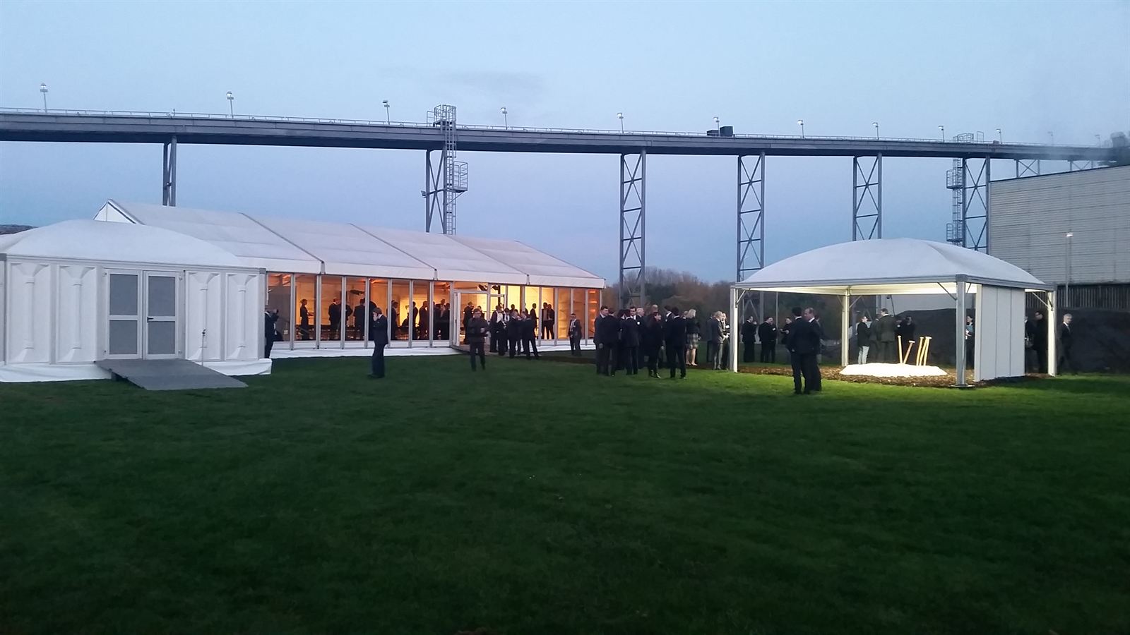 Illuminated event tents at dusk