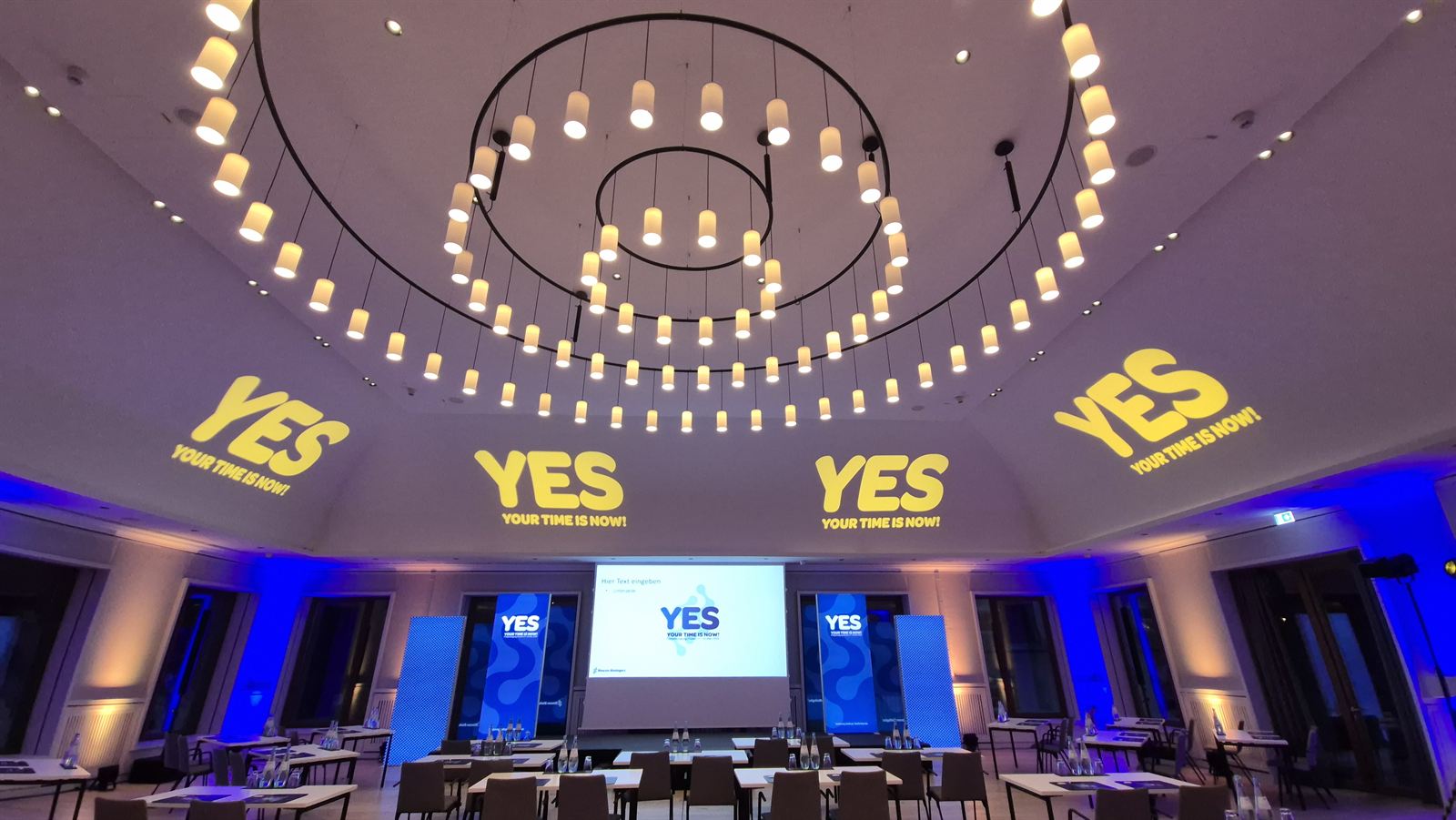 Meeting hall with projections and stage design