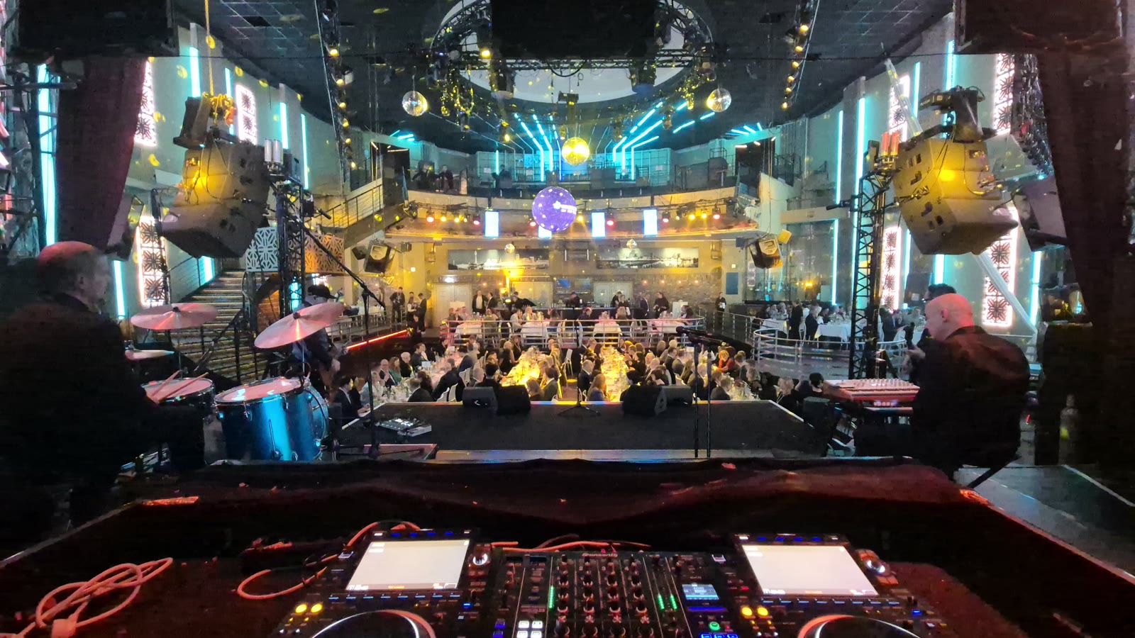 DJ booth on the illuminated main stage during the event